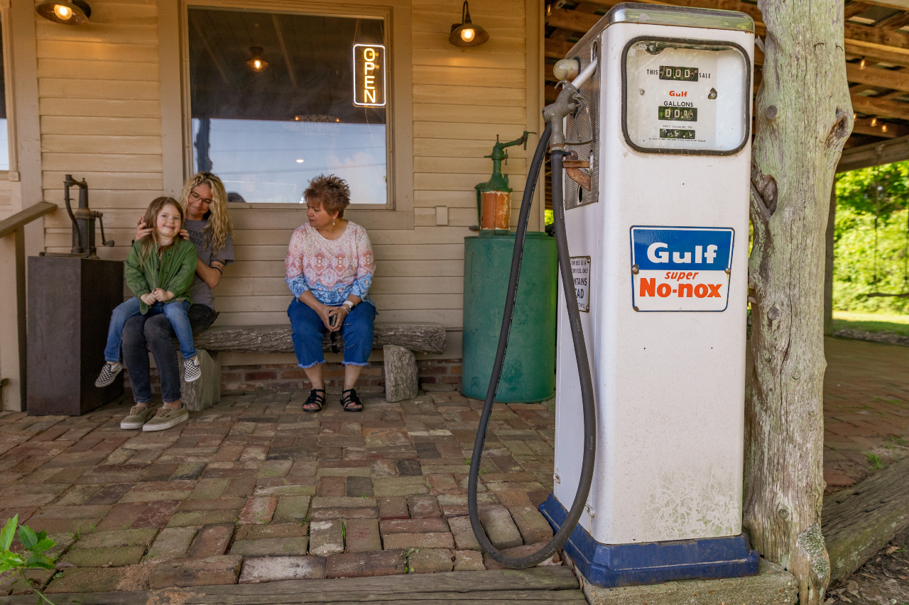 People chatting in front of country store